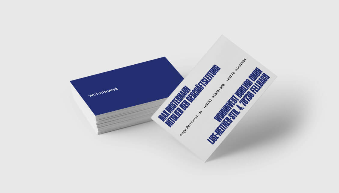 This picture shows the business cards of Wohninvest.