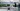 Frau mit Virtual Reality Brille vor dem virtuellen NRW Car 2.0, gestaltet von Mehnert Corporate Design in Kooperation mit der Folkwang Universität der Künste.