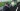 Mann mit Virtual Reality Brille vor dem virtuellen NRW Car 2.0, gestaltet von Mehnert Corporate Design in Kooperation mit der Folkwang Universität der Künste.
